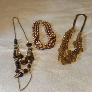 Brown and gold toned necklaces